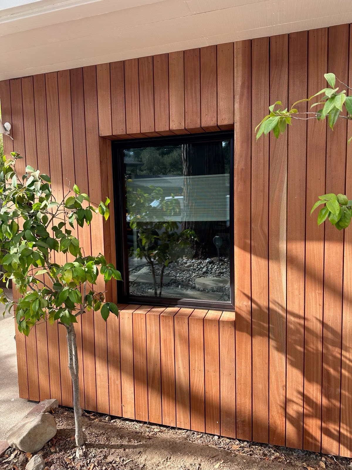 Cedar siding installed around a window